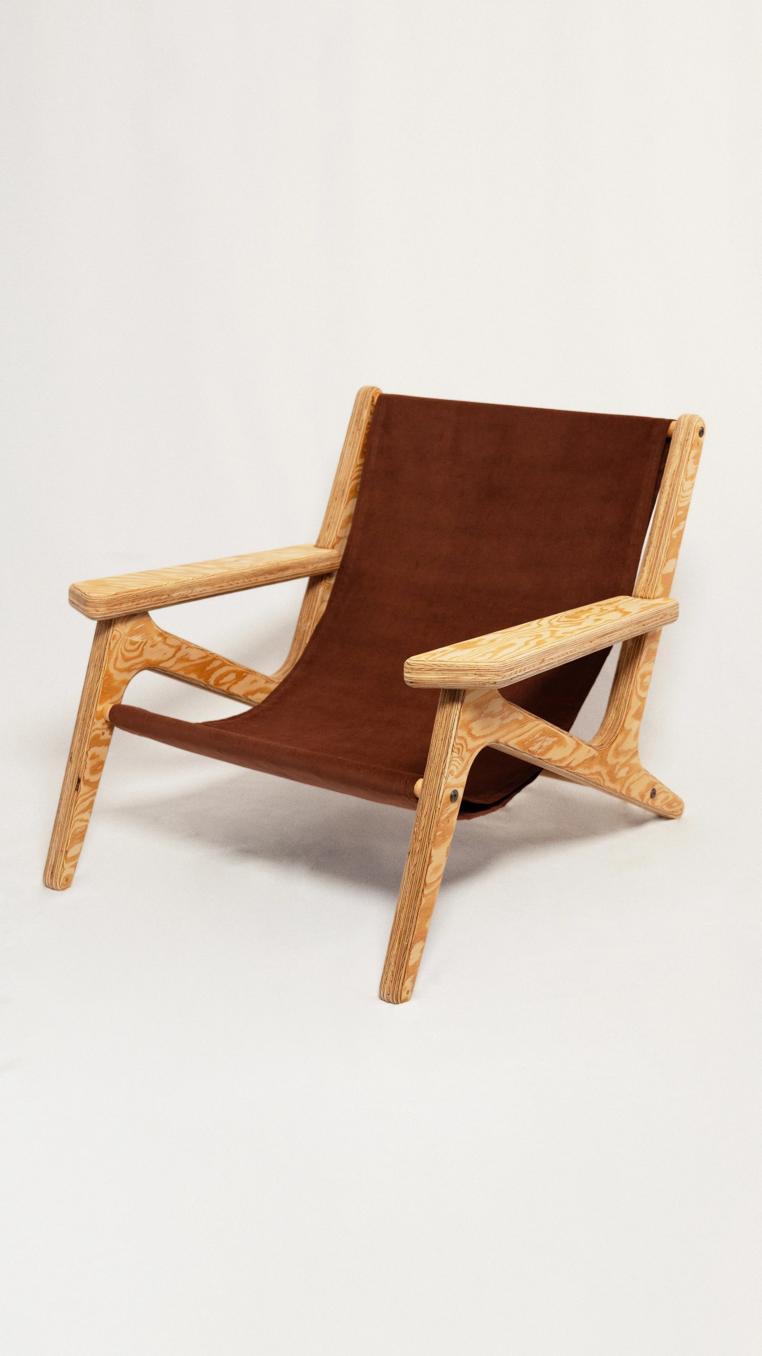 Lo.

Lo. is a boho sculptural plywood lounge chair designed and fabricated in-house in the Yukon, Canada using CNC precision and layered construction. Built from high-grade plywood and shaped with soft, rounded edges, it balances structural strength 