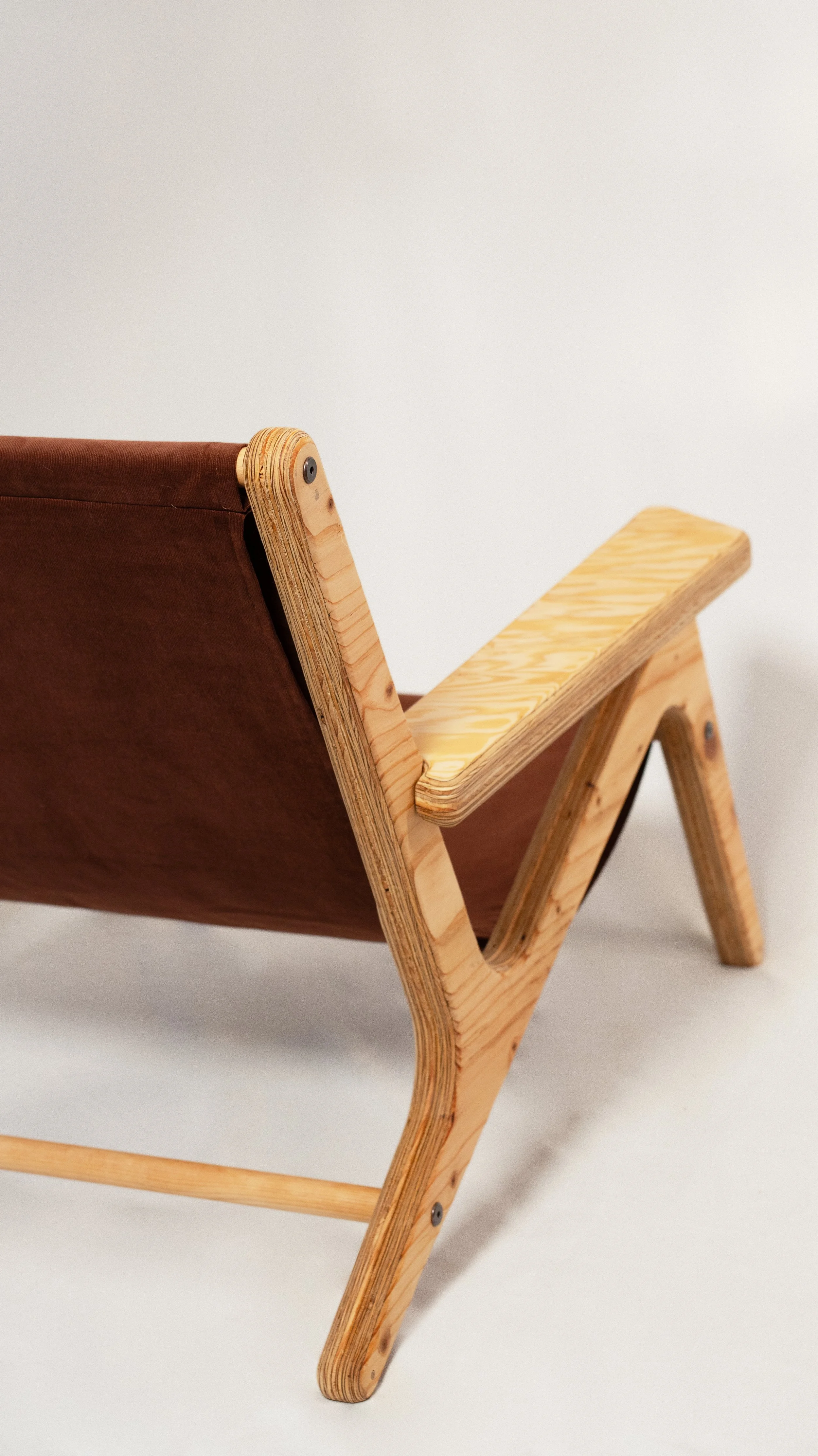 Lo.

Lo. is a boho sculptural plywood lounge chair designed and fabricated in-house in the Yukon, Canada using CNC precision and layered construction. Built from high-grade plywood and shaped with soft, rounded edges, it balances structural strength 