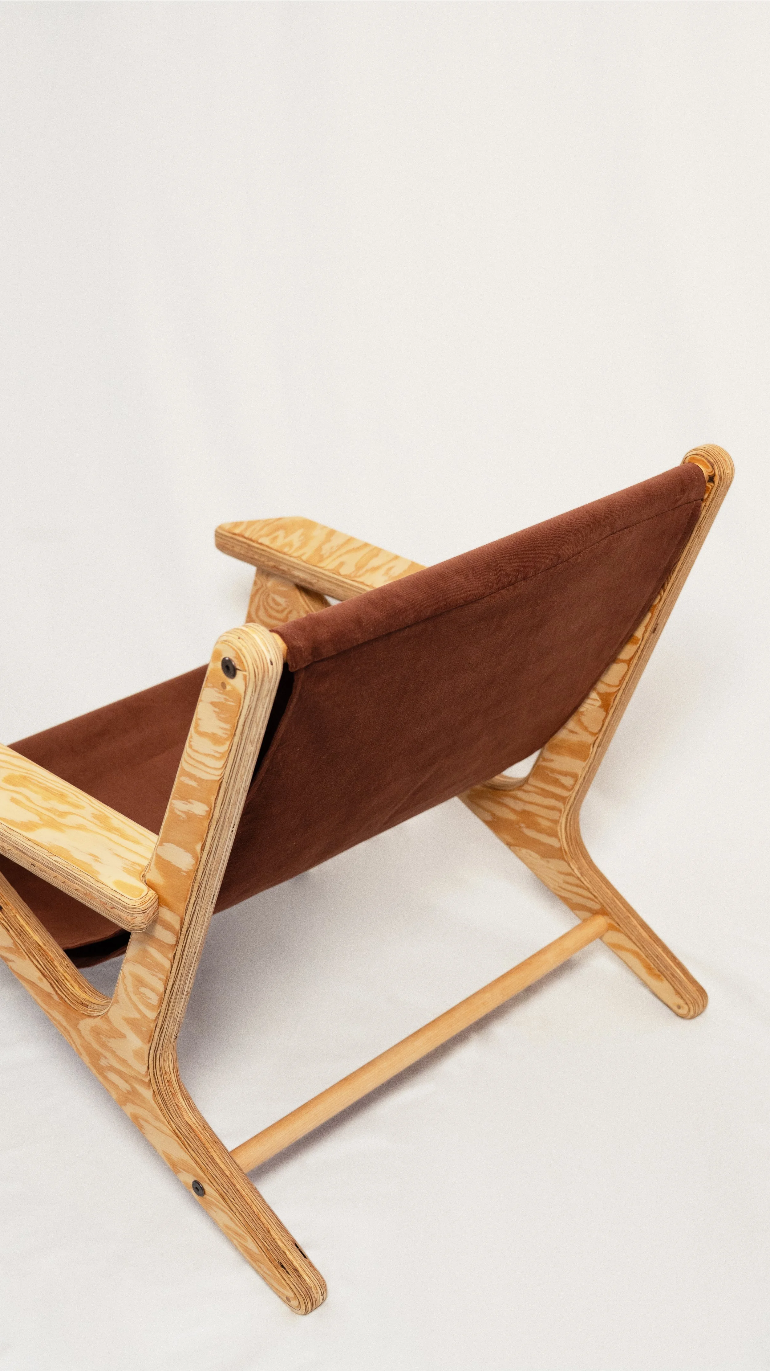 Lo.

Lo. is a boho sculptural plywood lounge chair designed and fabricated in-house in the Yukon, Canada using CNC precision and layered construction. Built from high-grade plywood and shaped with soft, rounded edges, it balances structural strength 