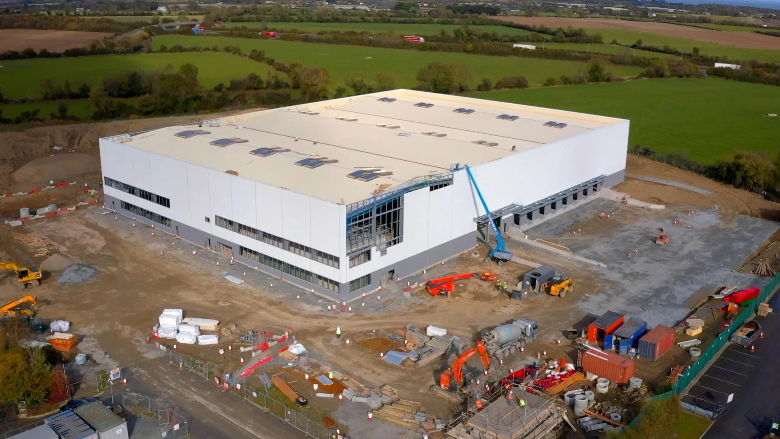Aerial progress image of a PCI Pharma Services construction project.