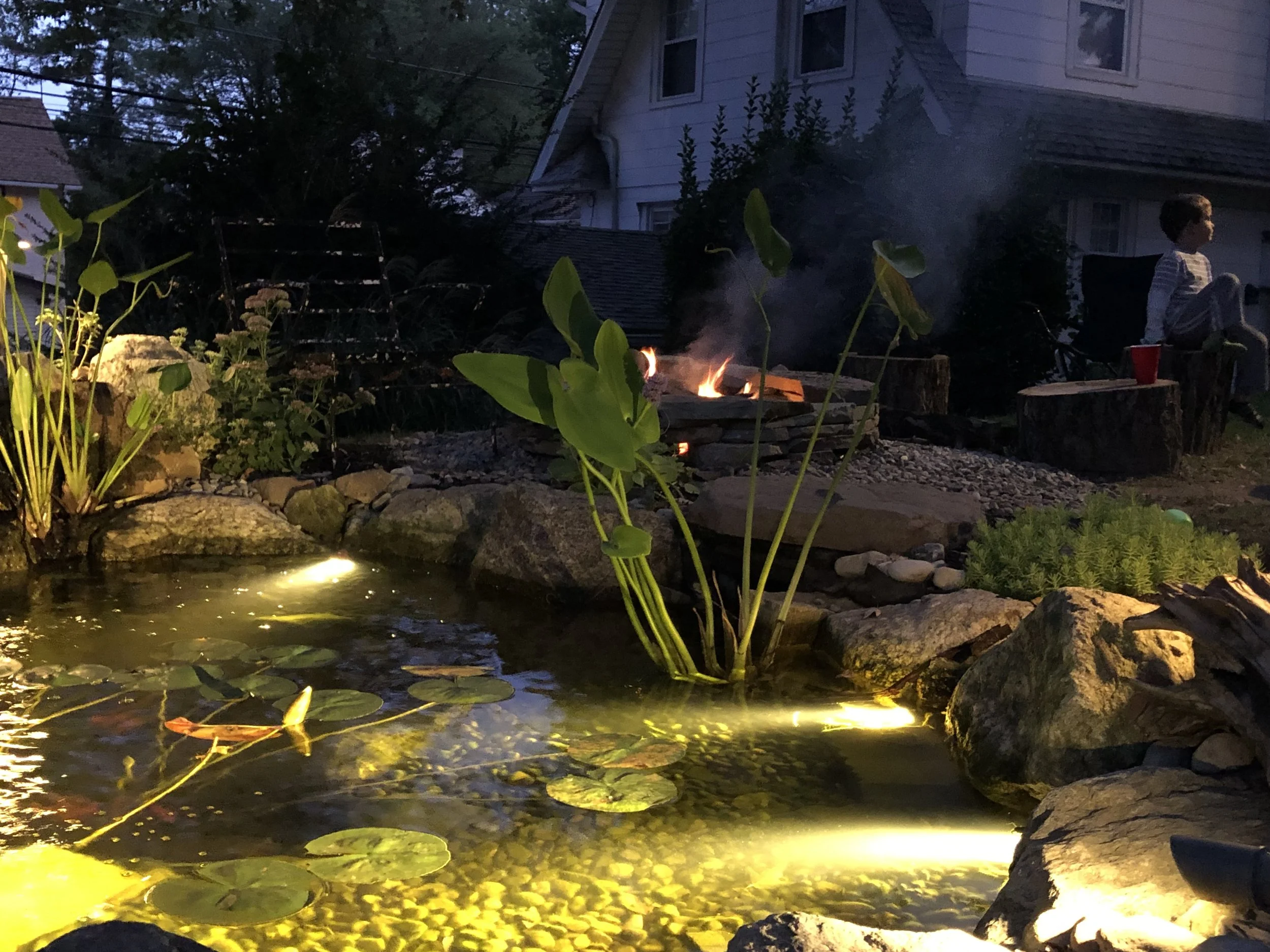 The only element that goes with water better than fish? Fire of course! This Newark, DE home brought in the best of both worlds with fire and water to encourage more time spent outdoors with the family.