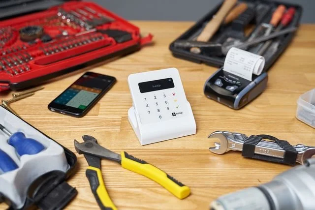 Payment terminal surrounded by tools