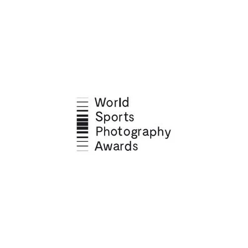 Logo for World Sports Photography Awards with vertical black lines forming a bar code next to the text
