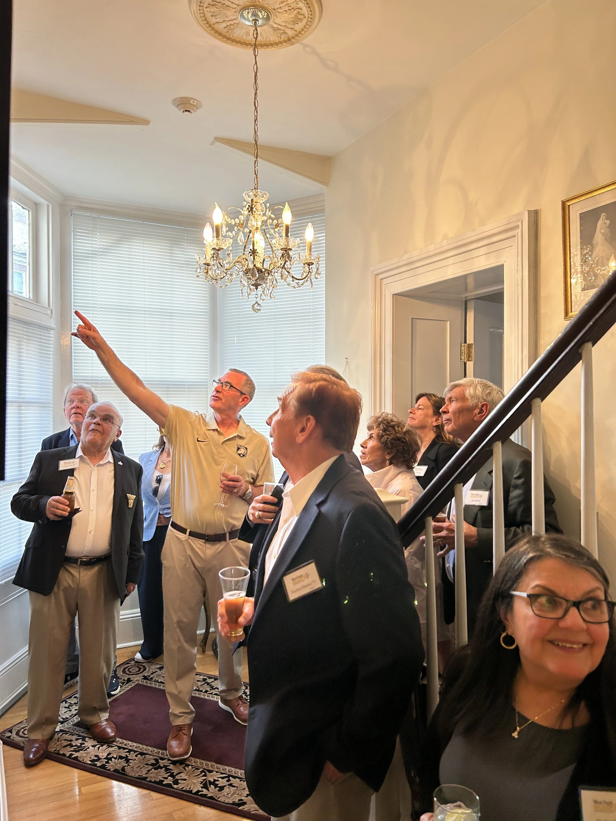 Brigadier General Shane Reeves ’96, Dean of the Academic Board, giving a tour of his home to Bill's friends and A4 classmates. 