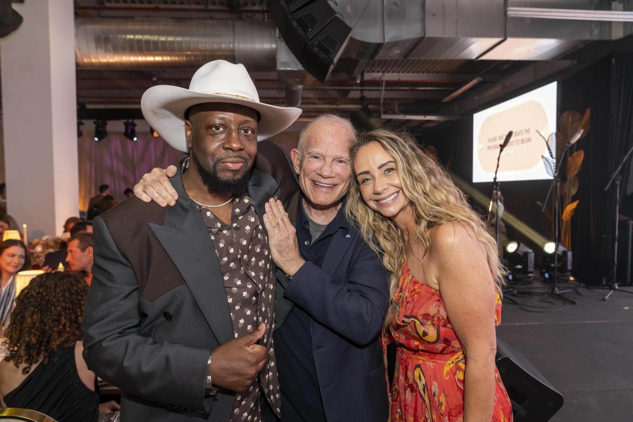 Bill with his wife Alex and Wyclef Jean after receiving the 2019 Players for Change Legend Award