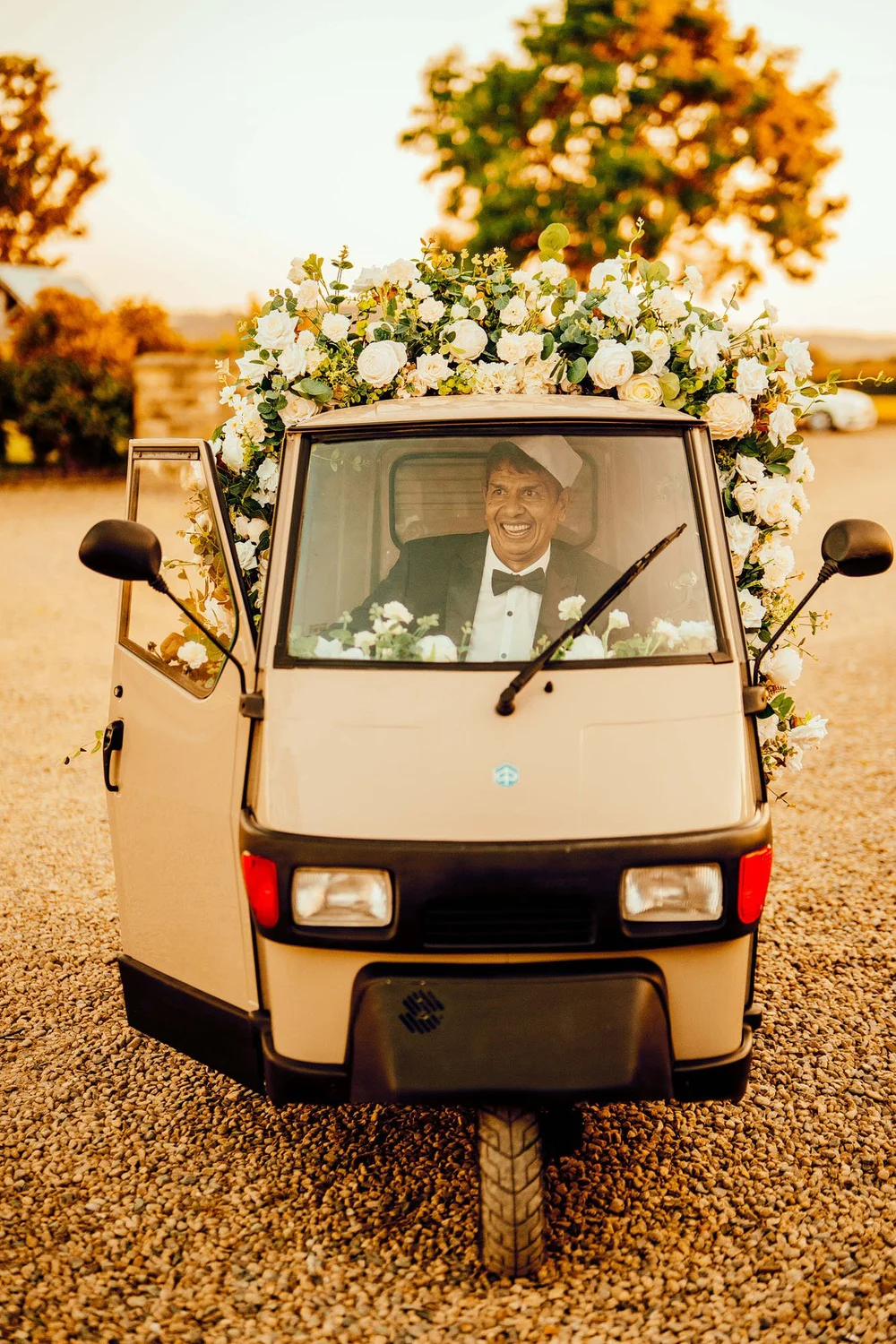 Scott and Bipin with their wedding ice cream tuk-tuk at a Yorkshire wedding