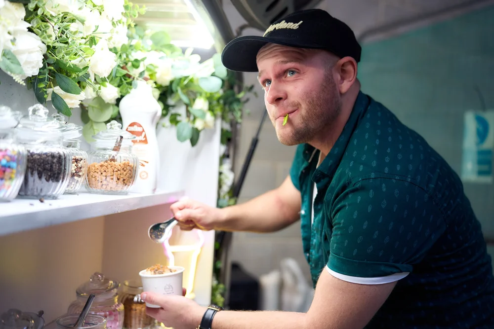 Attendant serving soft-serve at a branded corporate event
