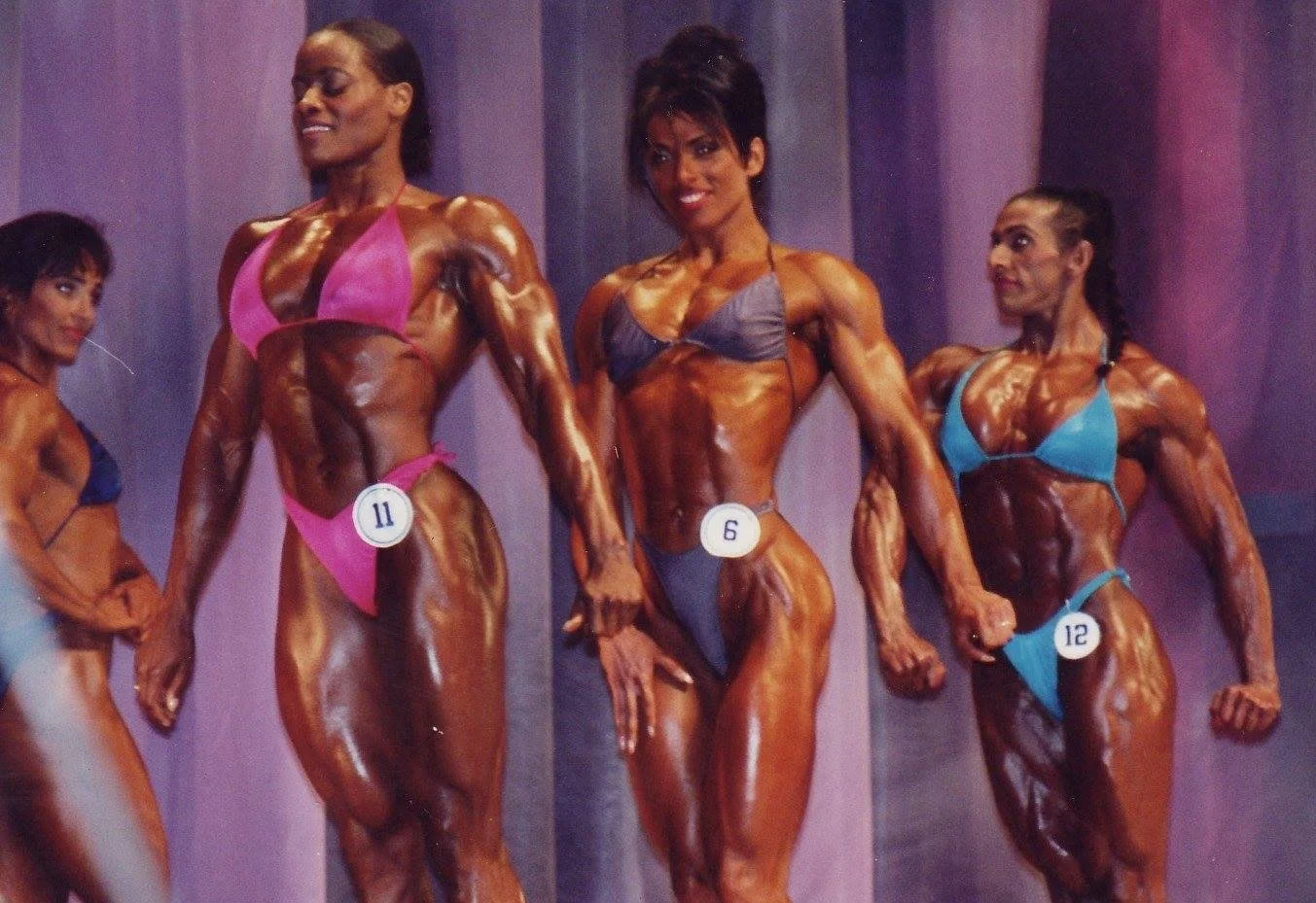1993 Ms Olympia
Yolanda Hughes, Sharon Bruneau and Marie Mahabir
Note; the late, Laura Bass, standing by in background