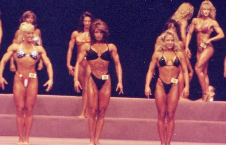 1995 Inaugural Ms Fitness Olympia.
Callouts - mandatory relaxed pose
Debbie Kruck, Sharon Bruneau, Monica Brant.
Background: Penny Price, Carol Anne Semple, Mia Finnigan (Winner of the 1st. Ms Fitness Olympia)