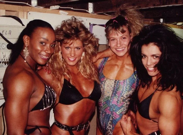 FIBO, Essen Germany 1992
Ms. Olympia Lenda Murray, late Champion Shelley Beattie, Champion from France (forgive me but her name eludes me) and big hair me on the end.😂