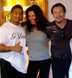 Love this photo as Body buildng meets up with Martial Arts. 
On my right (left looking at pic) Stan McQuay (one of my favourite male physiques)  Bodybuilding Champion and founder of Physique Inc.  Stan is always in incredible shape and has appeared i