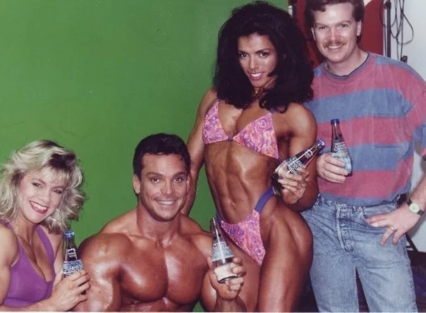 There was always a photoshoot or two in production at the Mecca, Gold's Gym during the 80s thru early 2000s. Never know who you might see at work when you walked into the gym. 
Well, here we are (Marla Duncan, Rich Gaspari and myself) working for Mus