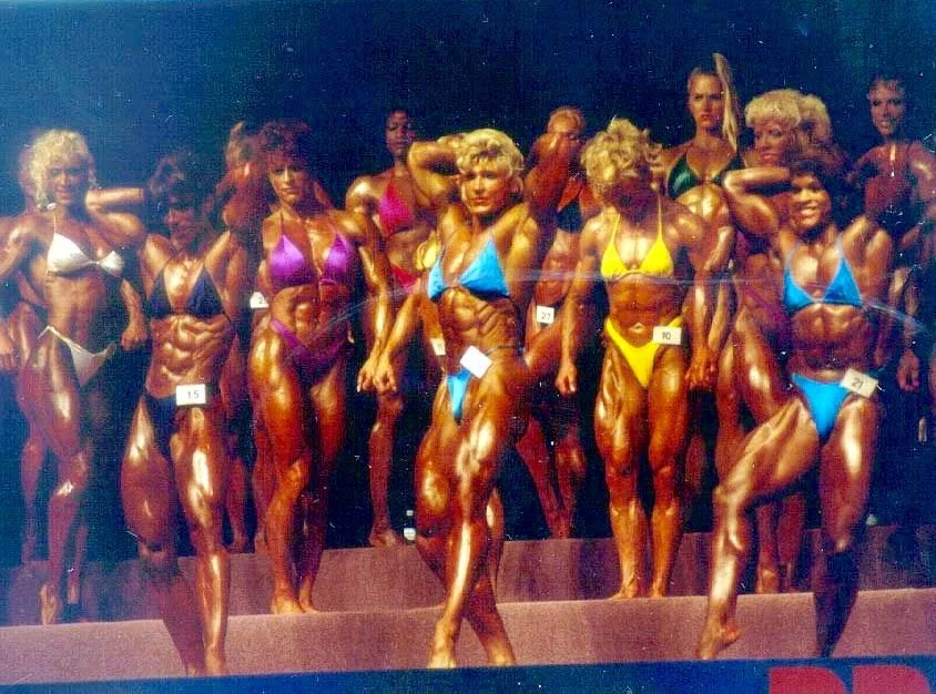 1993 Ms Olympia Morning Show
Call-outs; Sharon Bruneau, Nikki Fuller, Nancy Lewis.  Mandatory Abdominal/Quad Flex
Visible in the back: Kim Chizevsky, Diana Dennis, Lisa Lewis, (not sure who the blonde is in yellow - Sandy Riddell?), Debbie Muggli and