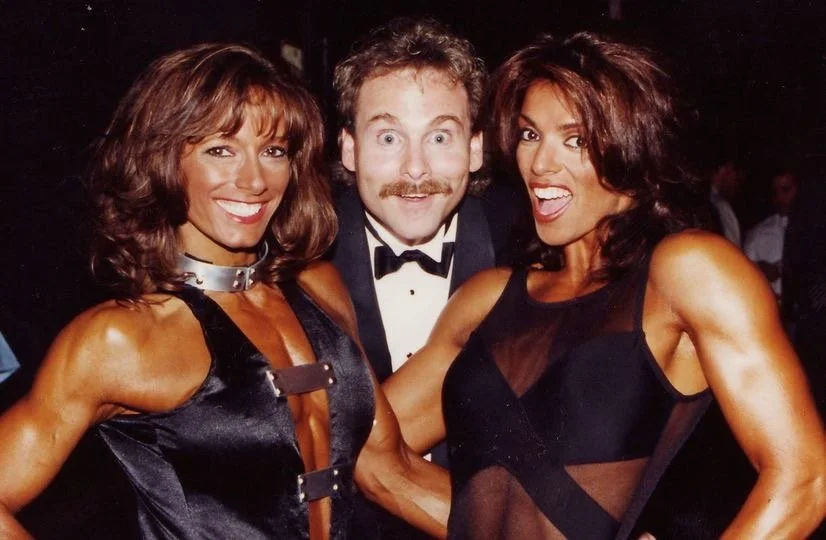 "Hamming it Up" backstage at the 1995 Ms Fitness Olympia.
Penny Price (L) and, Editor of Muscle & Fitness at that time, Tom Deters. Sharon Bruneau far R.