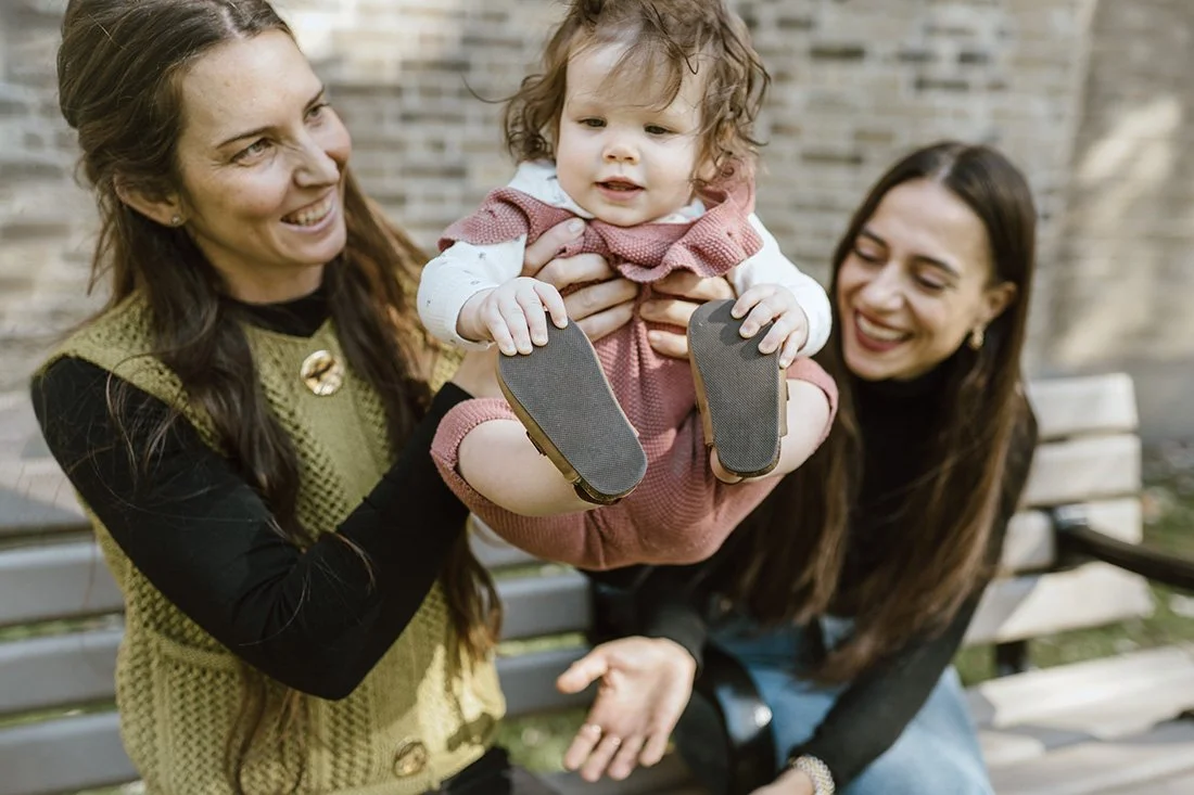 Queer family photography session at a park in the east end of Toronto during the fall