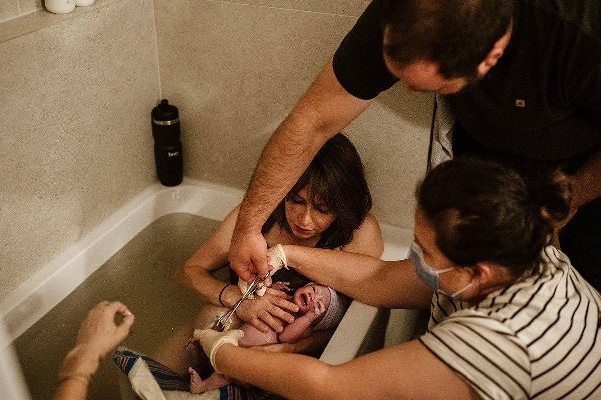 Tub birth cord cutting photographer in toronto