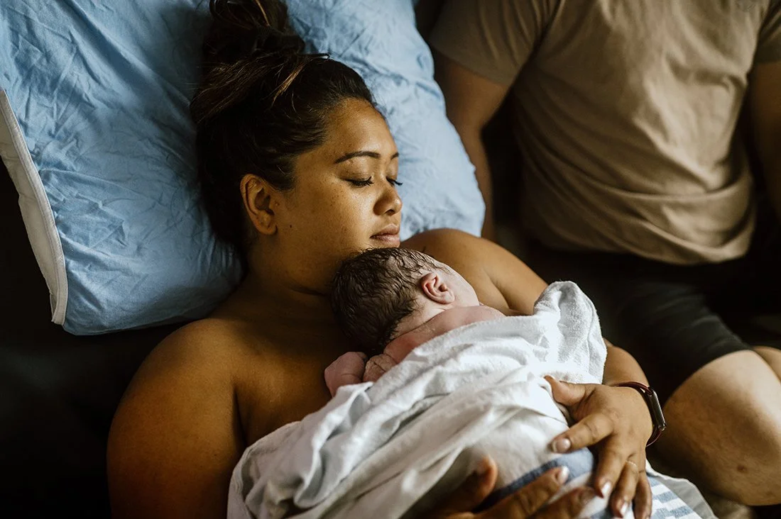 Newborn baby with mom after water tub birth in toronto hospital