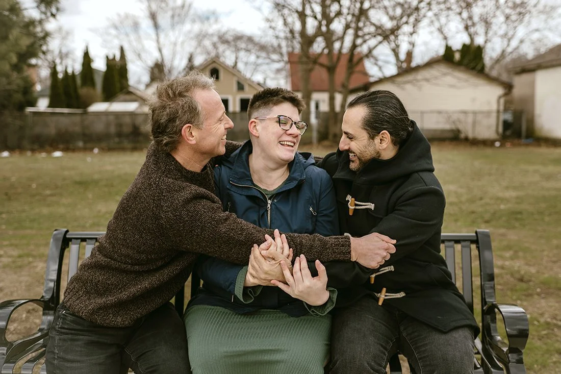 Surrogate with lgbtq parents maternity photography at a toronto park during the fall