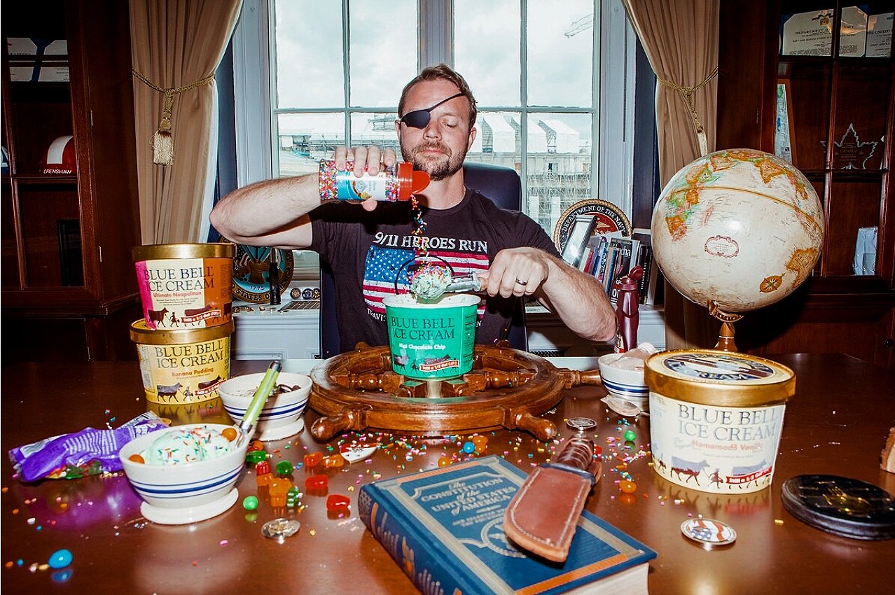 Rep. Dan Crenshaw (R-Tex.) adds toppings to his Blue Bell Ice Cream.