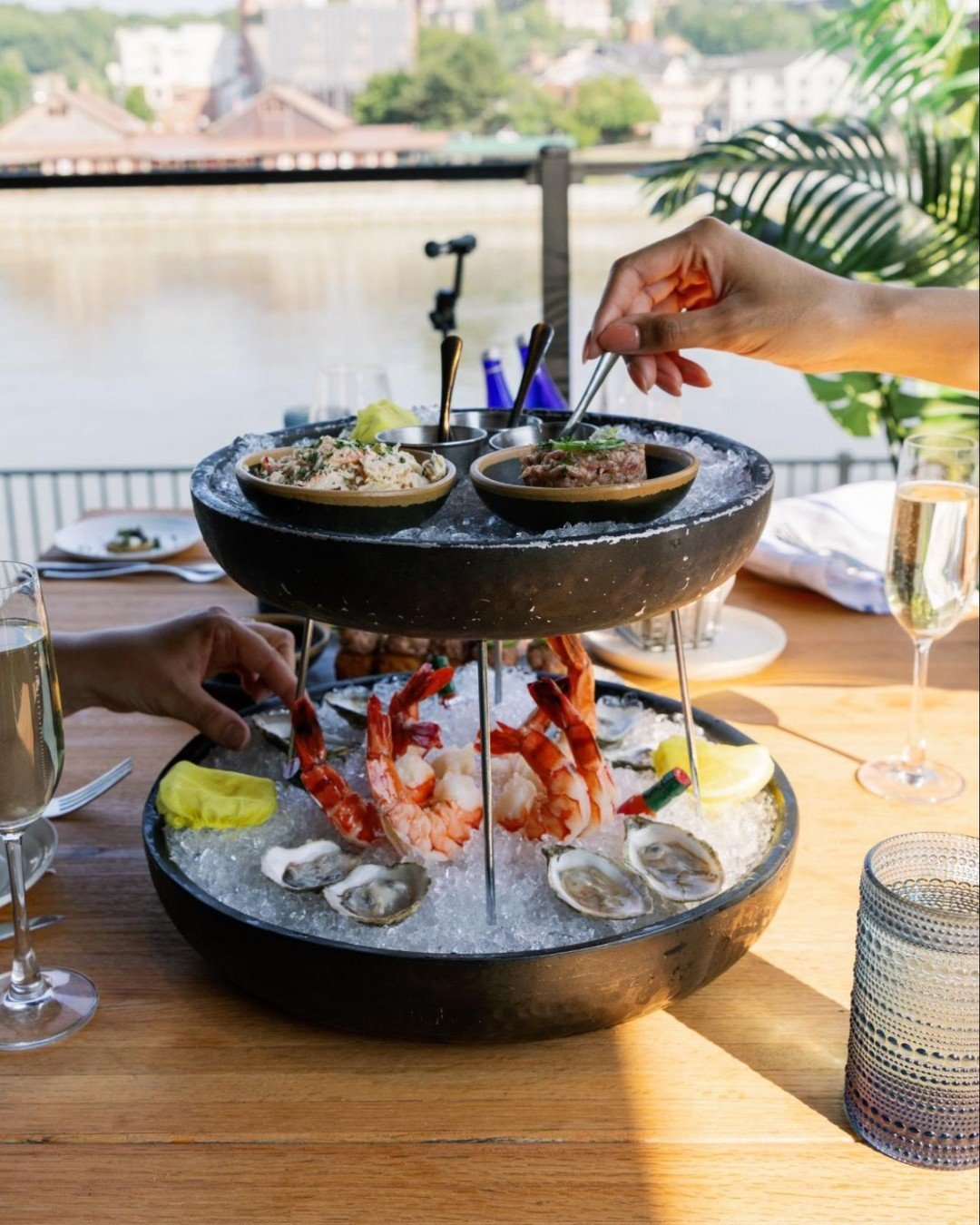 Seafood tower: the centerpiece your summer night deserves.