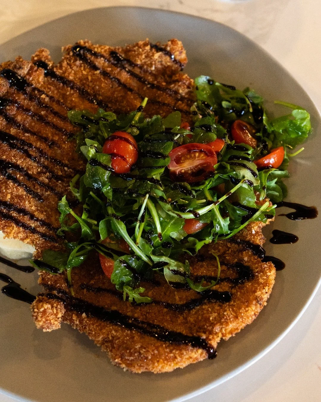 Fall is for cozy meals at Sea Smoke 🍂

PORK CHOP MILANESE | 14 oz. bone-in, pounded and breaded, whipped potato,
arugula, tomato, lemon, olive oil, balsamic reduction