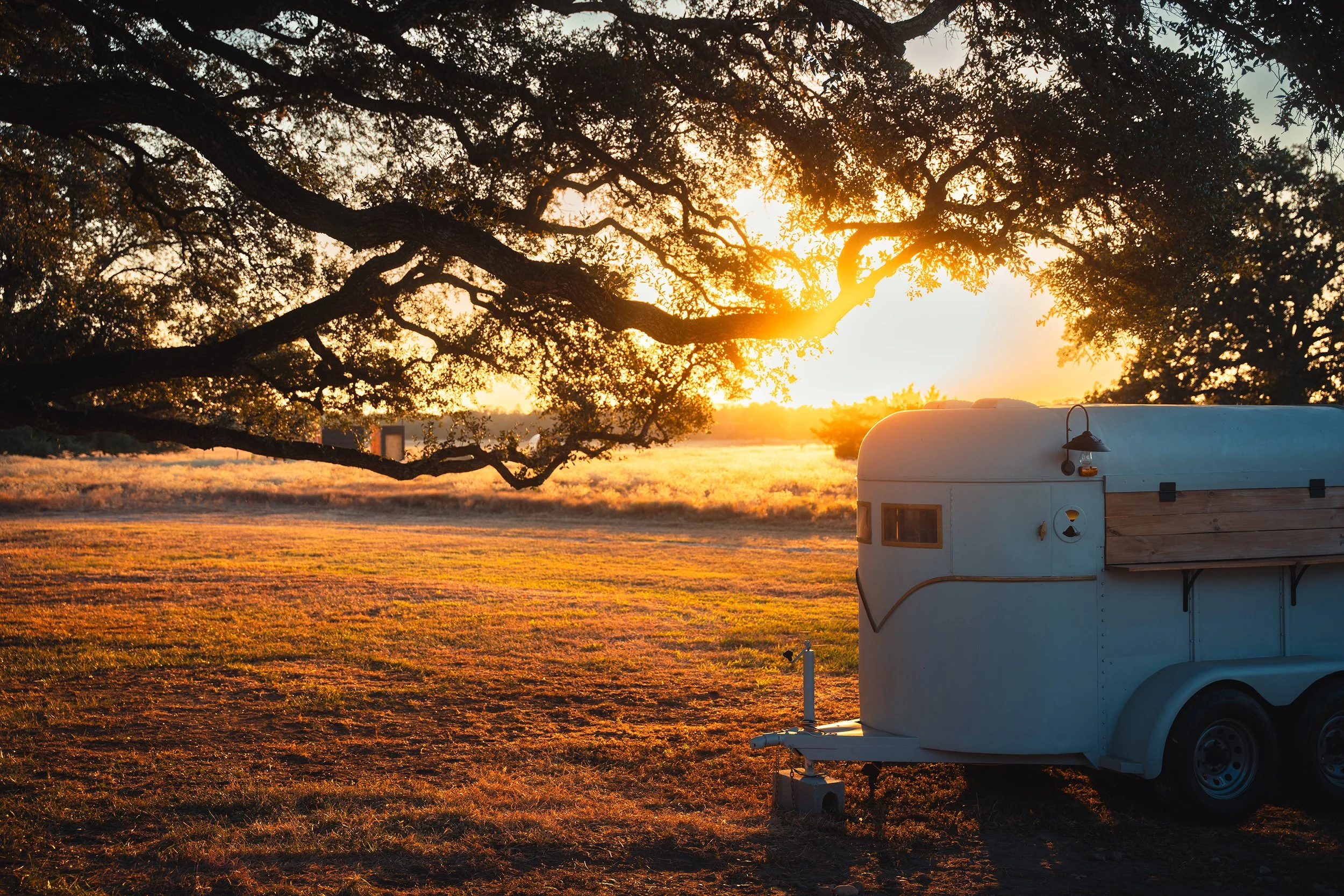 Custom horse trailer bar at sunset on the grounds of Stardust Ranch, showcasing event design, hospitality experiences, and branded activations for luxury ranch guests and corporate retreats.