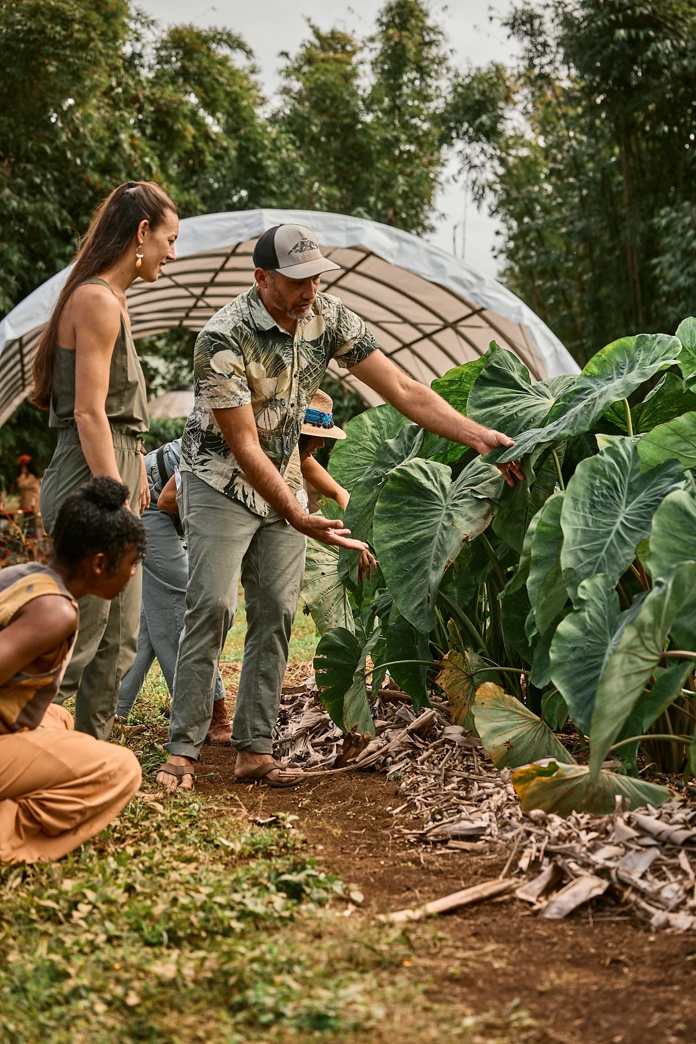 Guests participating in a guided farm tour at Starseed Ranch on Hawaii Island, highlighting agritourism experiences, retreat programming, and destination marketing services.