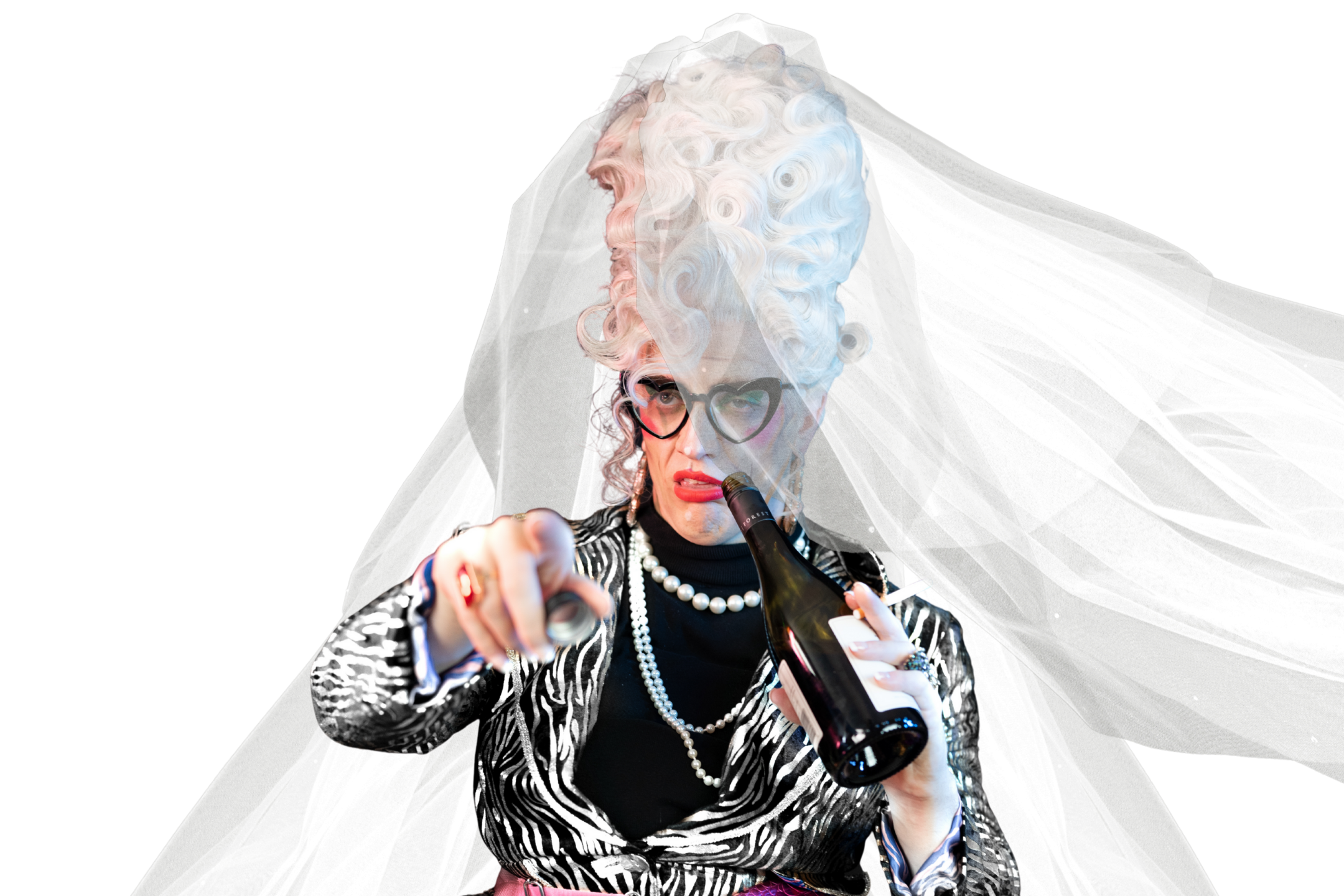 A person dressed in a zebra-patterned jacket and wearing pearls, with a large, elaborate white wig and black glasses, appears to be pointing at the camera while holding a bottle of wine and a glass. The background is solid black, and a sheer white veil is draped behind them.