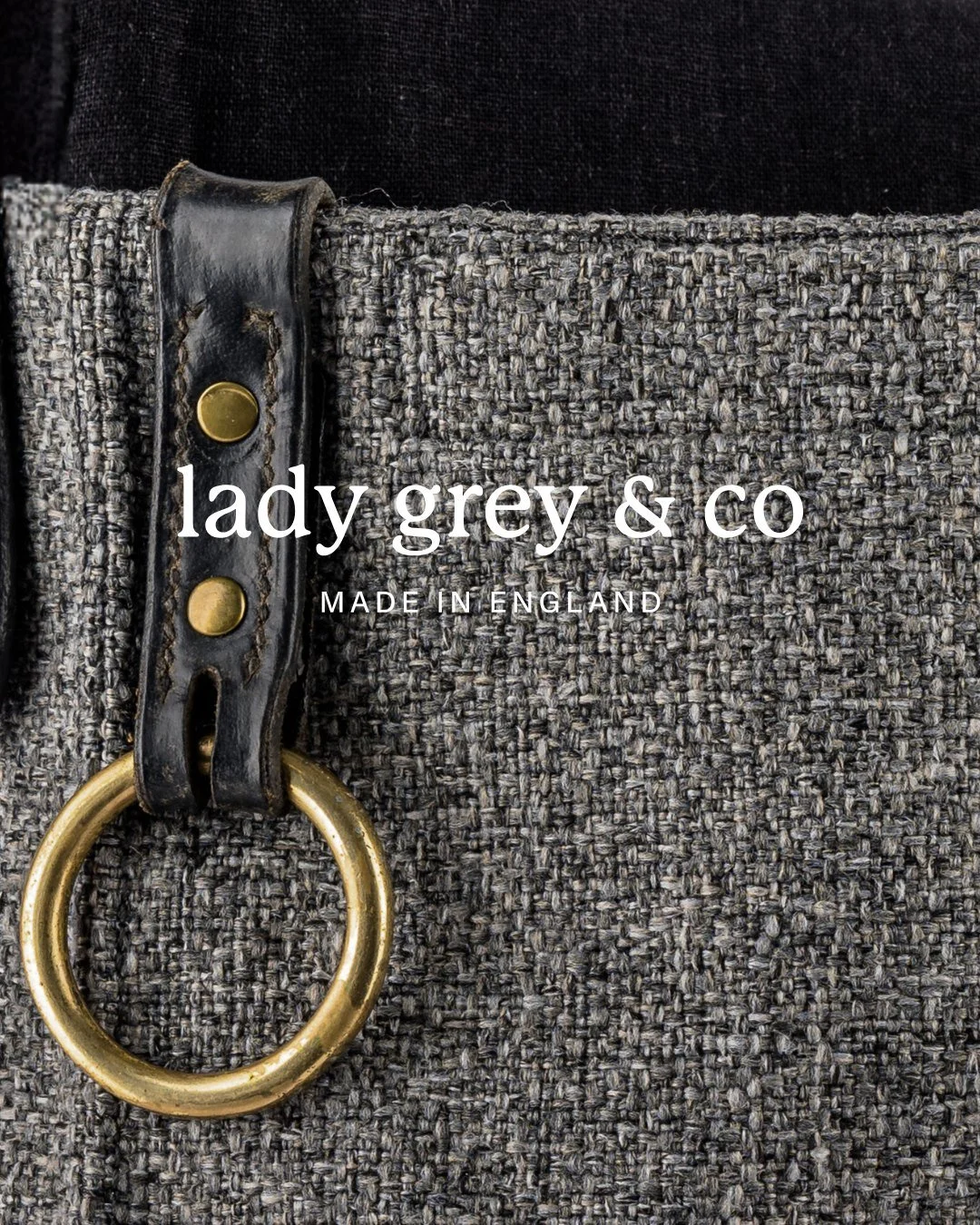 It&rsquo;s all in the details.

This Legacy Bag brings together heritage equestrian leather and premium mottled grey fabric, finished with solid brass hardware and a discreet pocket designed for everyday use.

Turn it over, and the story continues - 