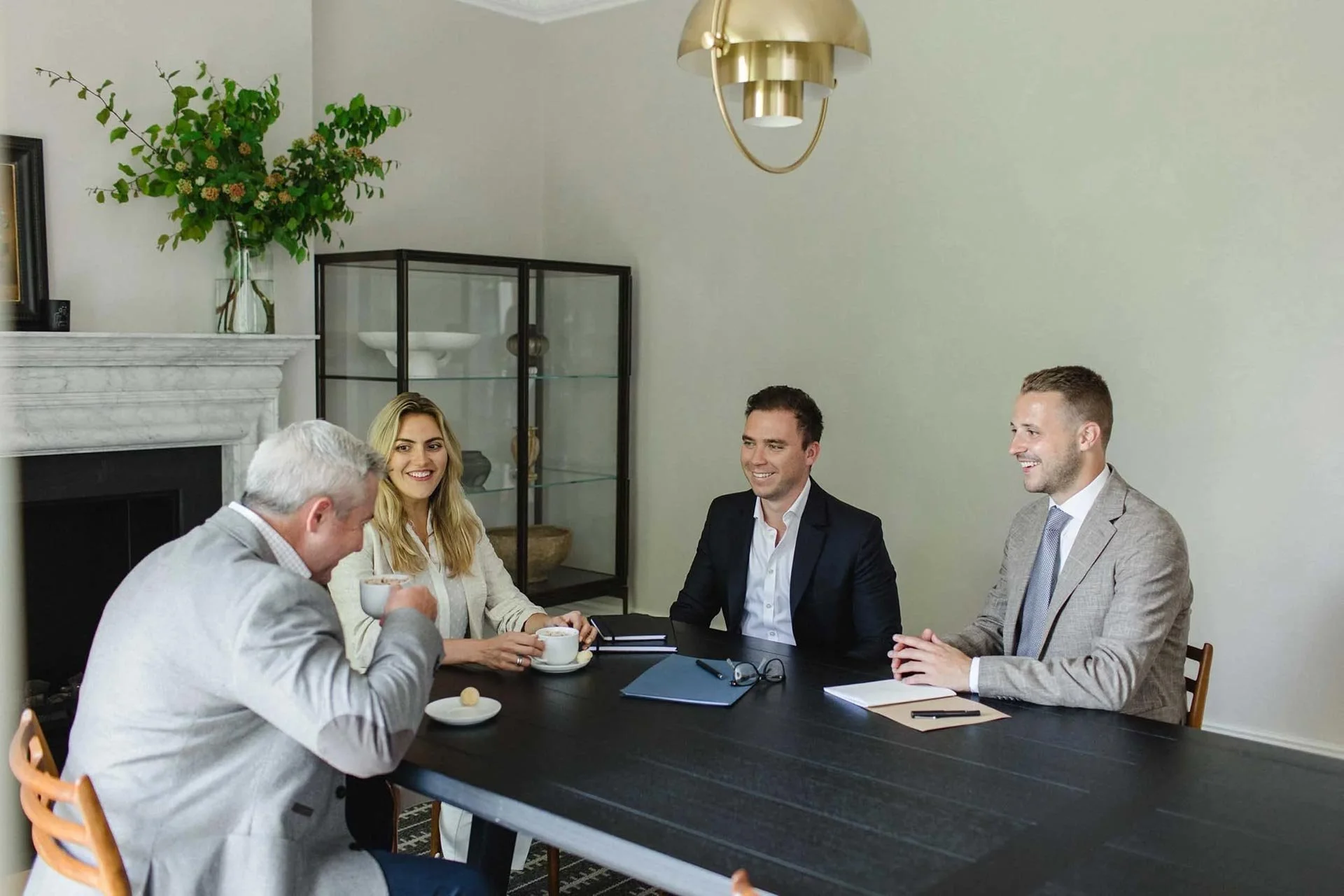 Chartered accountants discussing personal accountancy at a table