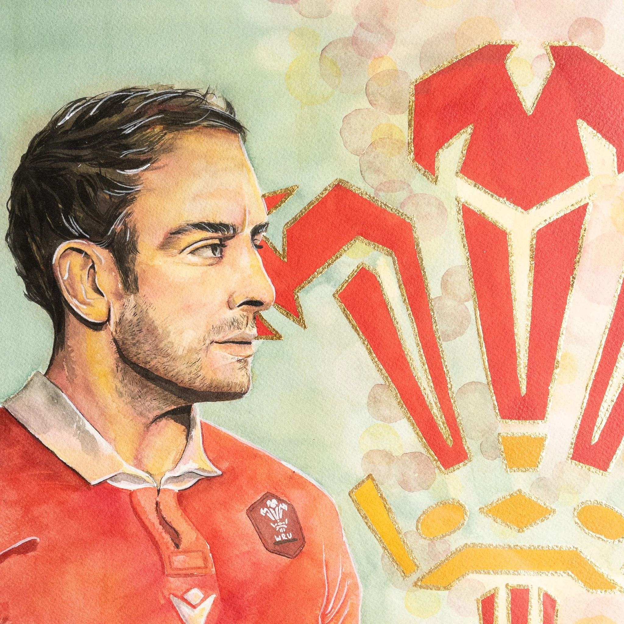 Détail de l'aquarelle originale — portrait d'Alun Wyn Jones, feuilles d'or et grain du papier Arches