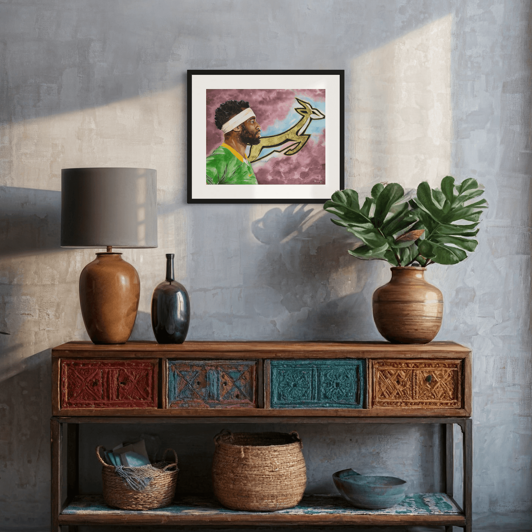 Custom framed, hand-embellished fine art print of South African rugby player Siya Kolisi, displayed in a black frame with custom mat, set above a colourful, rustic console table.