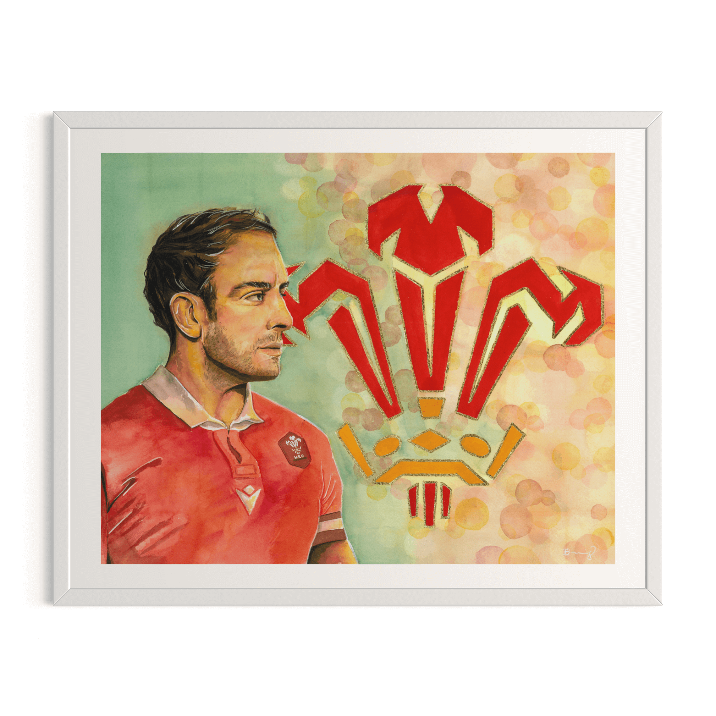 40 x 50 cm fine art print of Welsh rugby player Alun Wyn Jones in a signature red jersey. Features hand-embellished gold Welsh rugby emblem and standard 40 x 50 cm white frame.