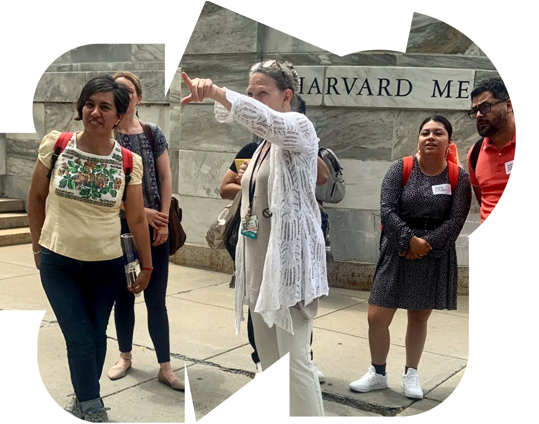 A group of adults standing together outdoors, engaged in conversation and learning, reflecting collaboration between practitioners and communities in real-world settings. Harvard