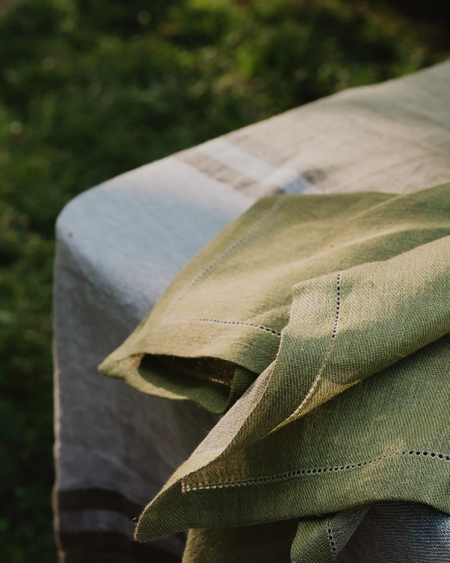 There's a reason linen has been on tables for centuries. Texture, breathability, and the way it softens with use - the fabric of a slow summer meal.