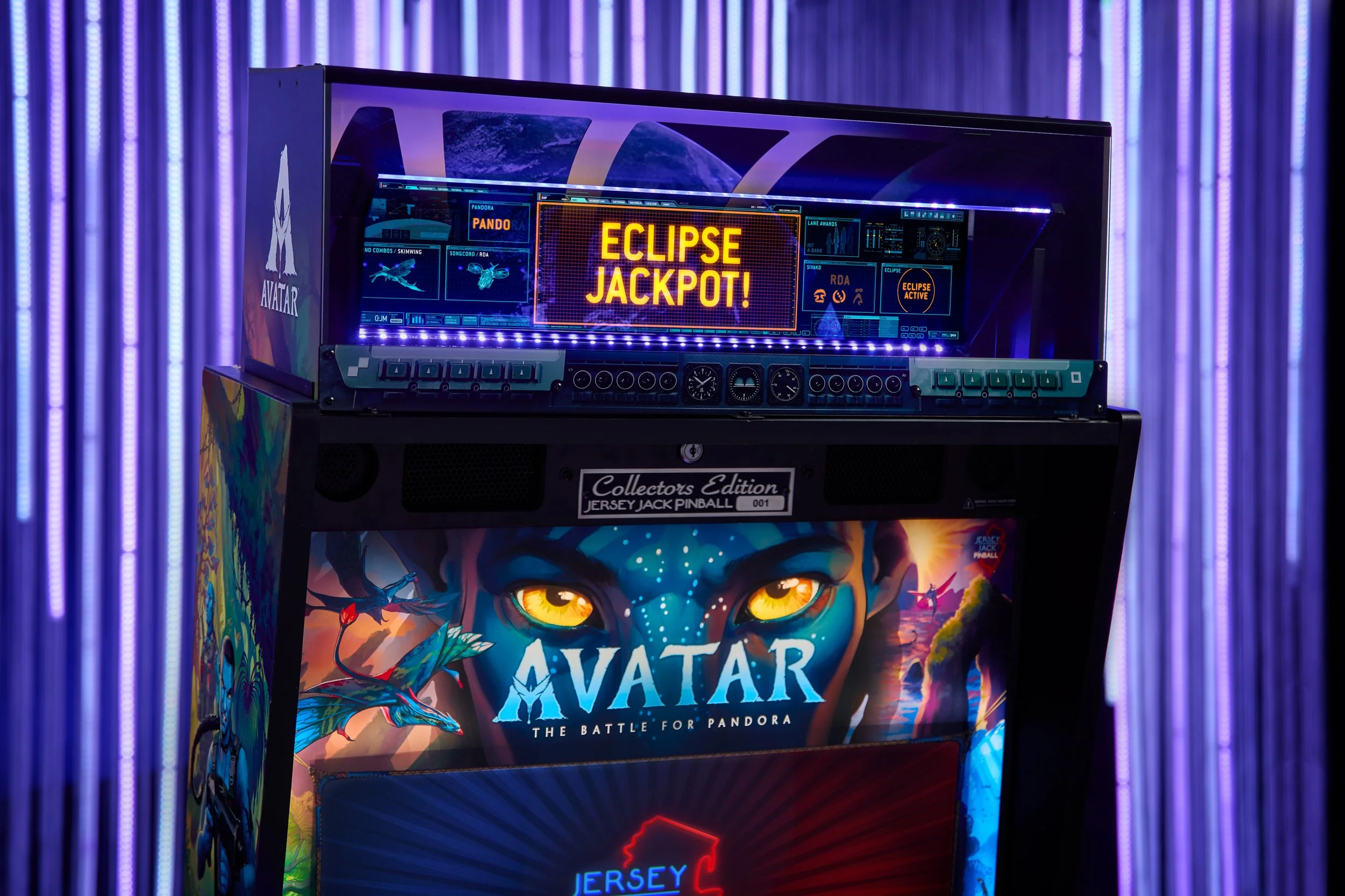 A pinball machine featuring the game 'Avatar: The Battle for Pandora' with a colorful and detailed art design, showcasing an intense scene from the game, with an illuminated scoreboard that reads 'Eclipse Jackpot!'
