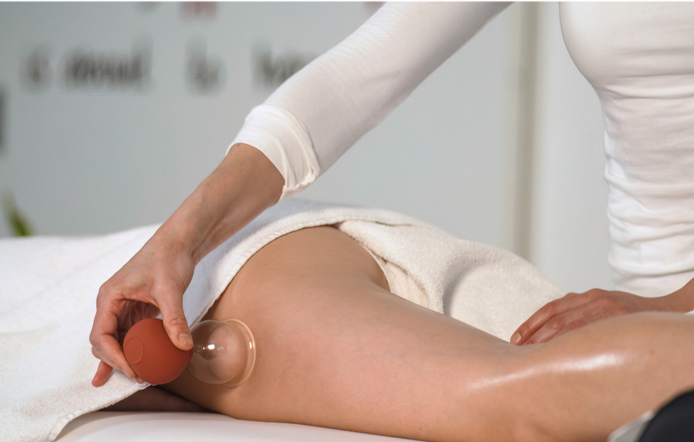 Nourish & Sculpt Lymphatic Drainage Massage, combining Traditional Vodder Manual Lymphatic Drainage, Brazilian Body Sculpting Massage, Fascial Freedom Myofascial Release, and Cupping Therapy to reduce bloating, swelling, cellulite and tension