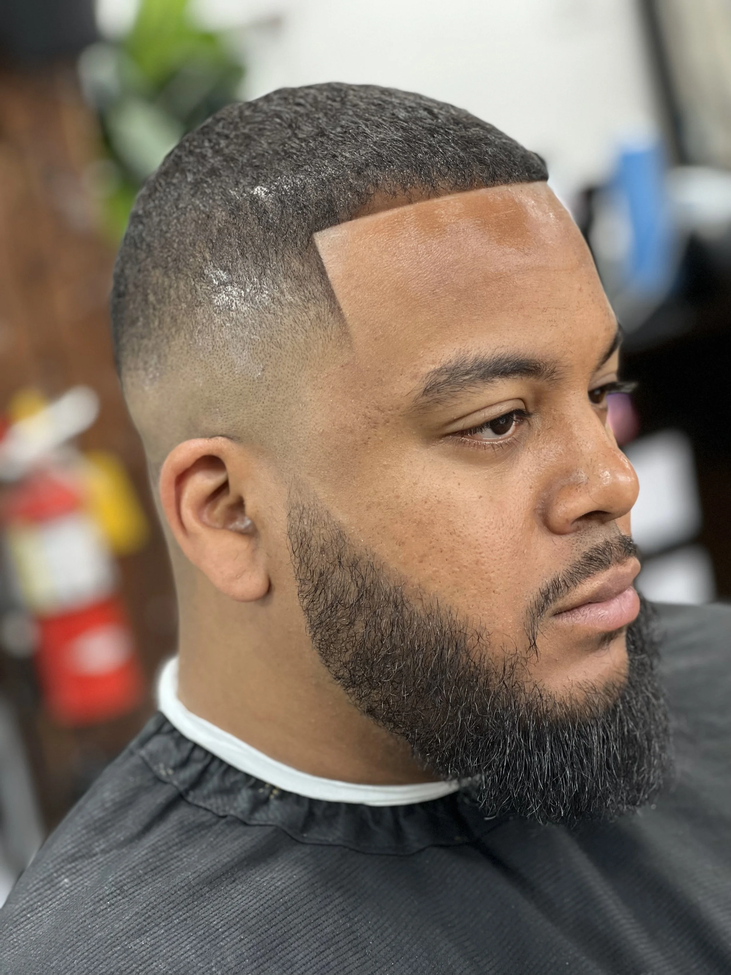 Sleek and refined modern men's haircut