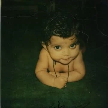 1980 · The First Ray

I was born in Bombay, now Mumbai, into a multigenerational family rooted in storytelling and tradition. Named by my grandfather’s sister, a poet, Twisha means “the first ray of the sun,” a name connected to my father, Nahush, wh