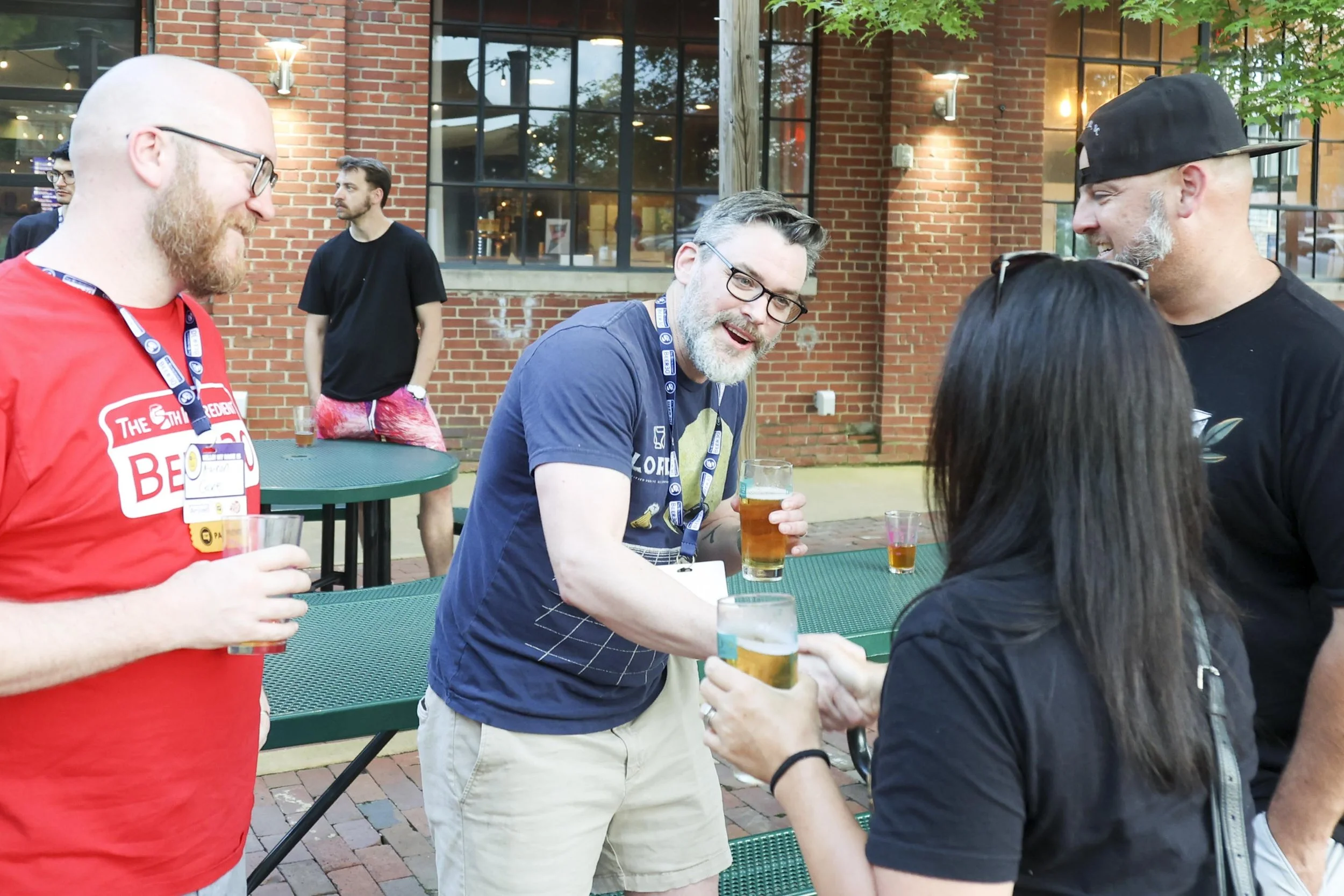 people networking and meeting outside of a brewery