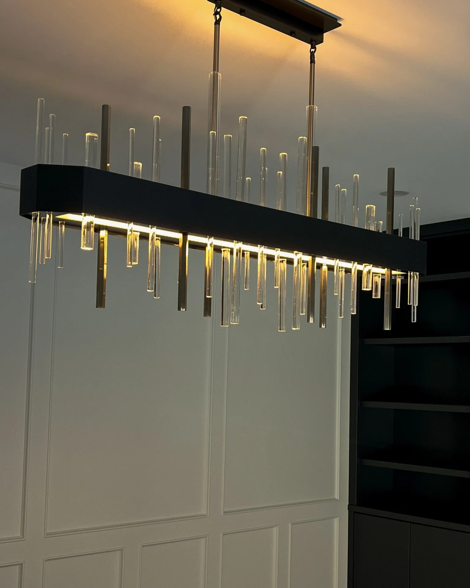 It&rsquo;s always a treat when clients are after more unique pieces for their home. Take this statement linear chandelier as a perfect example!

The request: crystal, linear and timeless with dark elements to match the cabinetry.

Once we finally lai