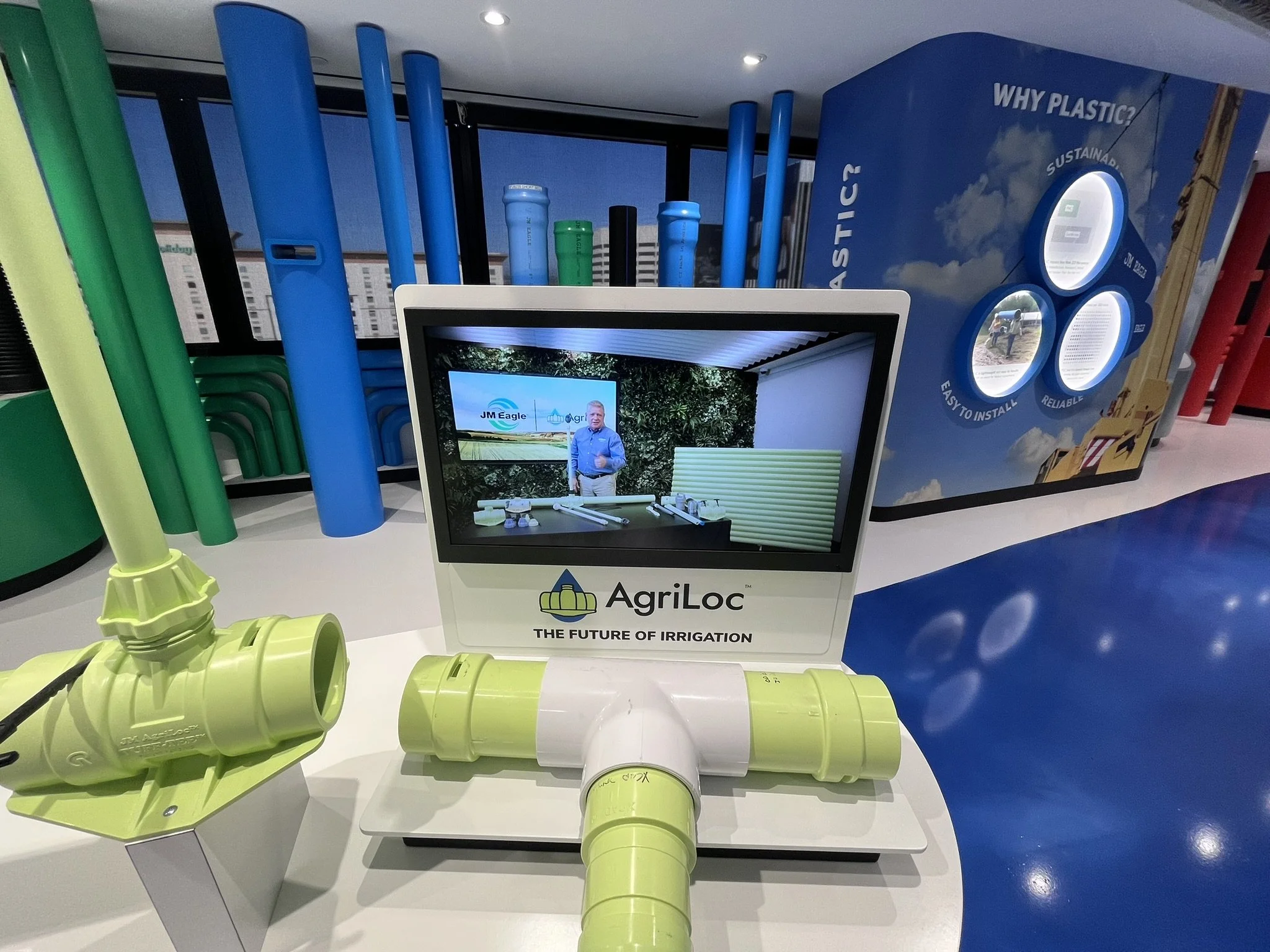 Center island spotlighting featured innovative products with tactile display and video.
Image Credit: Bridgewater Studio