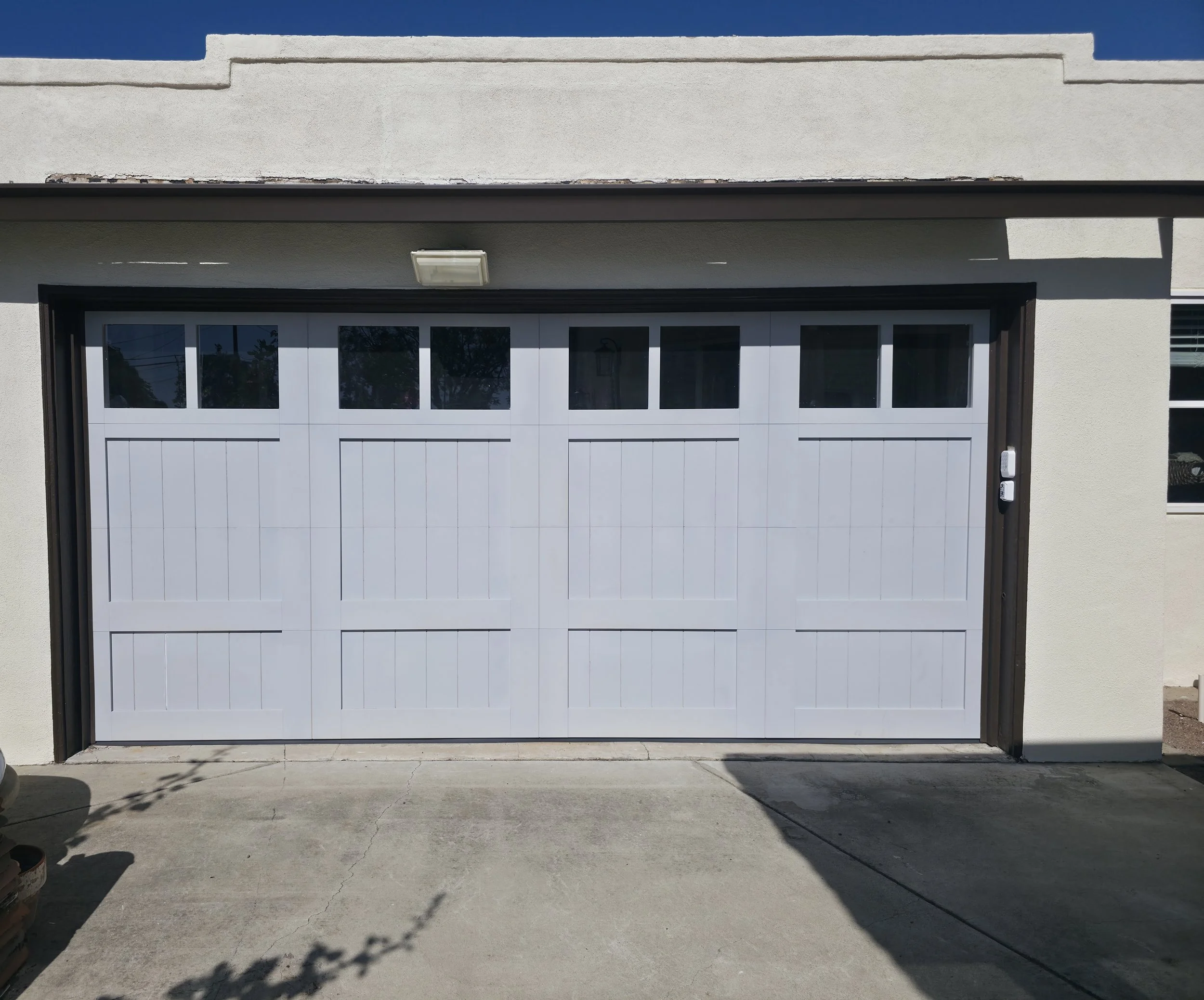 Carriage House Doors primed steel overlay