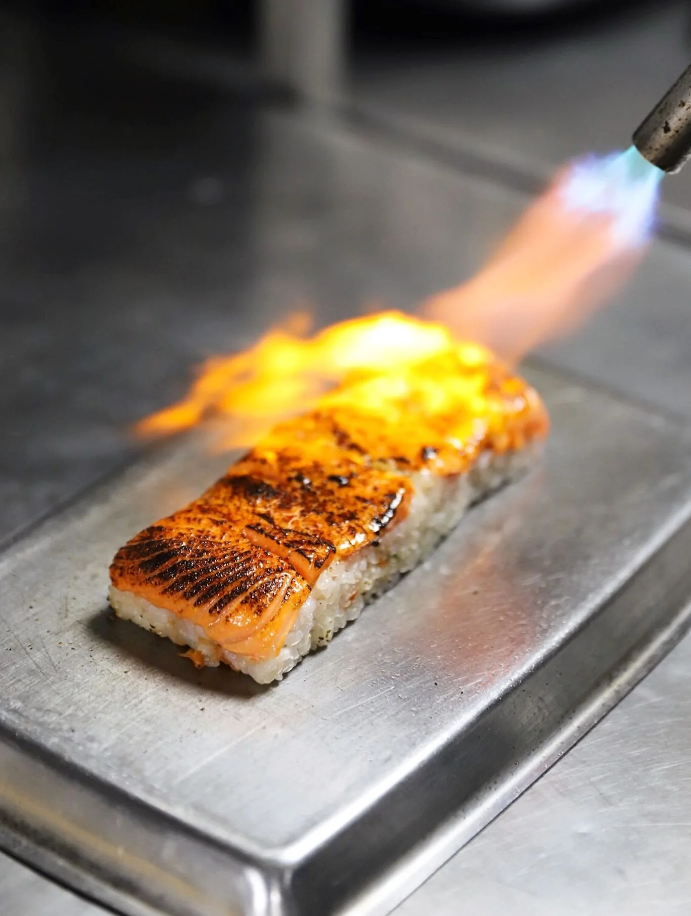 how aburi salmon got his stripes! 🐅🐅🐅 reservations avail with the link in bio - walk-ins accepted, too! 🖤