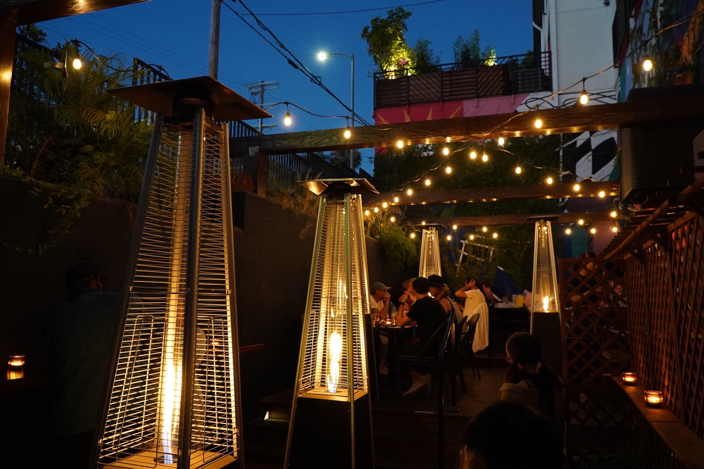 Budonoki's enclosed, heated patio at night under string lights