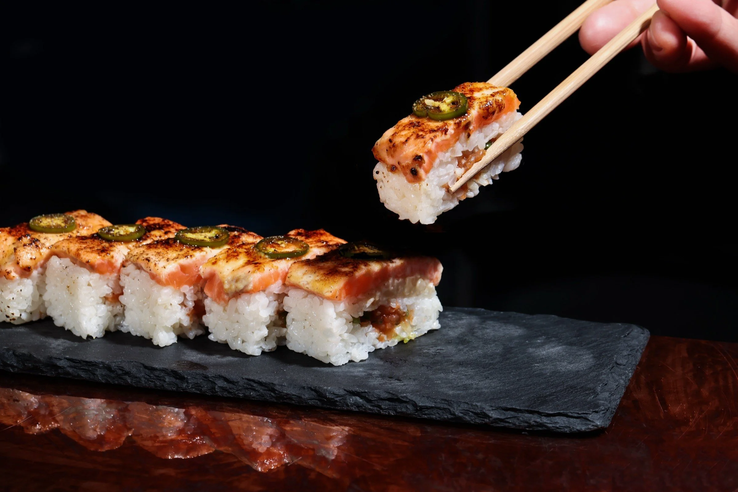 Oshizushi (pressed sushi) with seared salmon and jalapeño at Budonoki