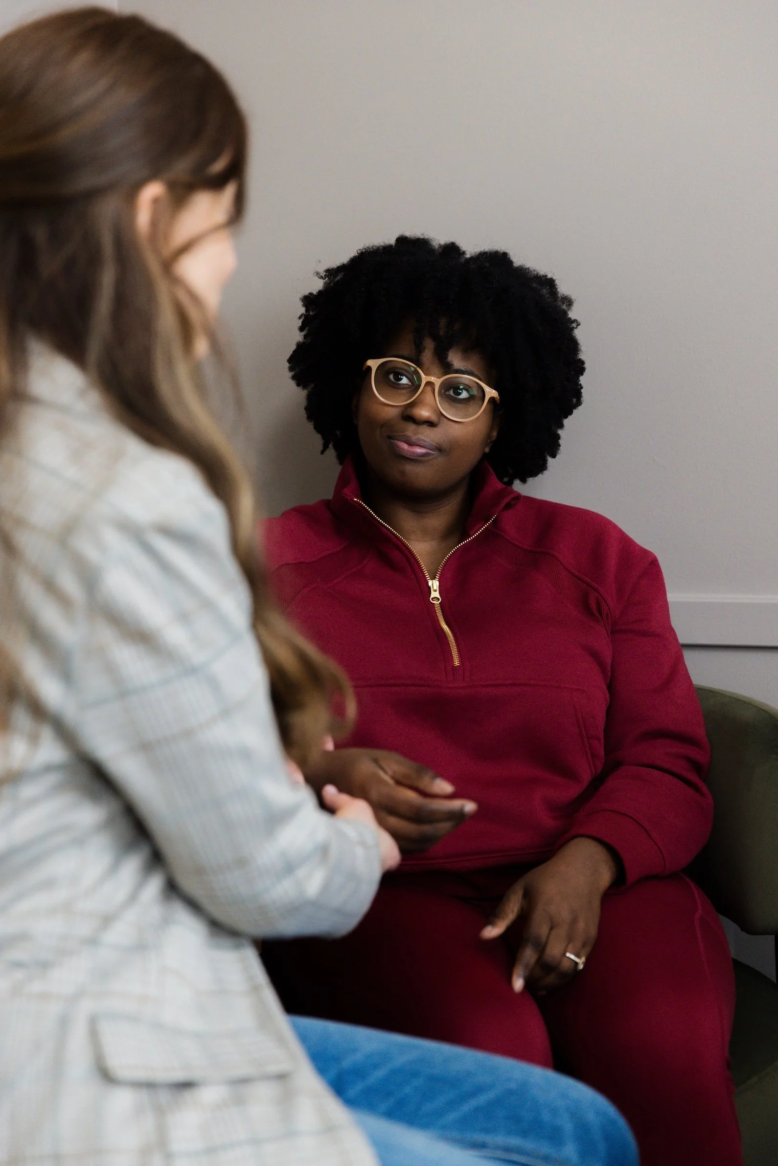 woman speaking with a holistic functional health practitioner