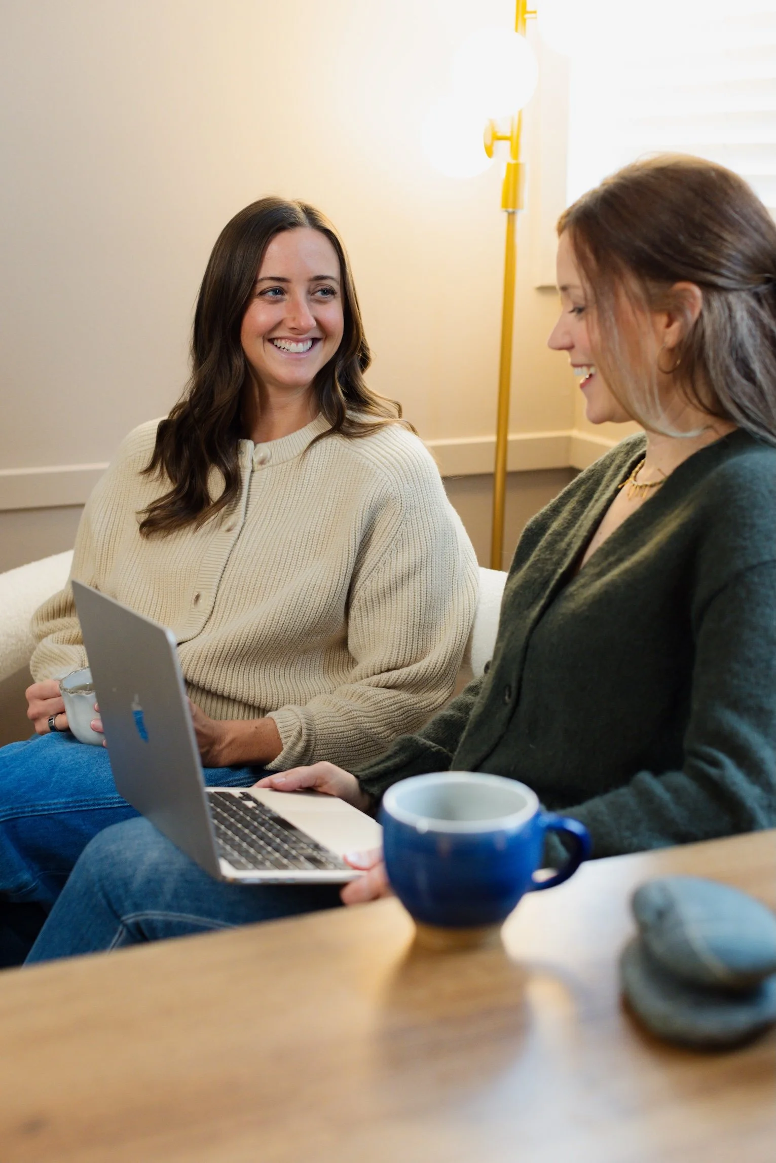 two women having a meeting in an office setting
