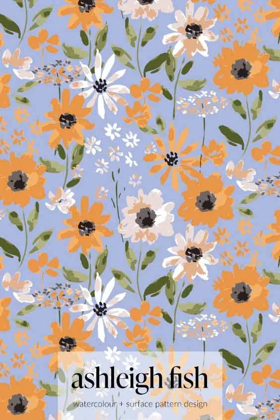 Floral pattern with orange and white flowers on a light blue background, featuring green leaves. Includes the text "ashleigh fish, watercolor + surface pattern design."