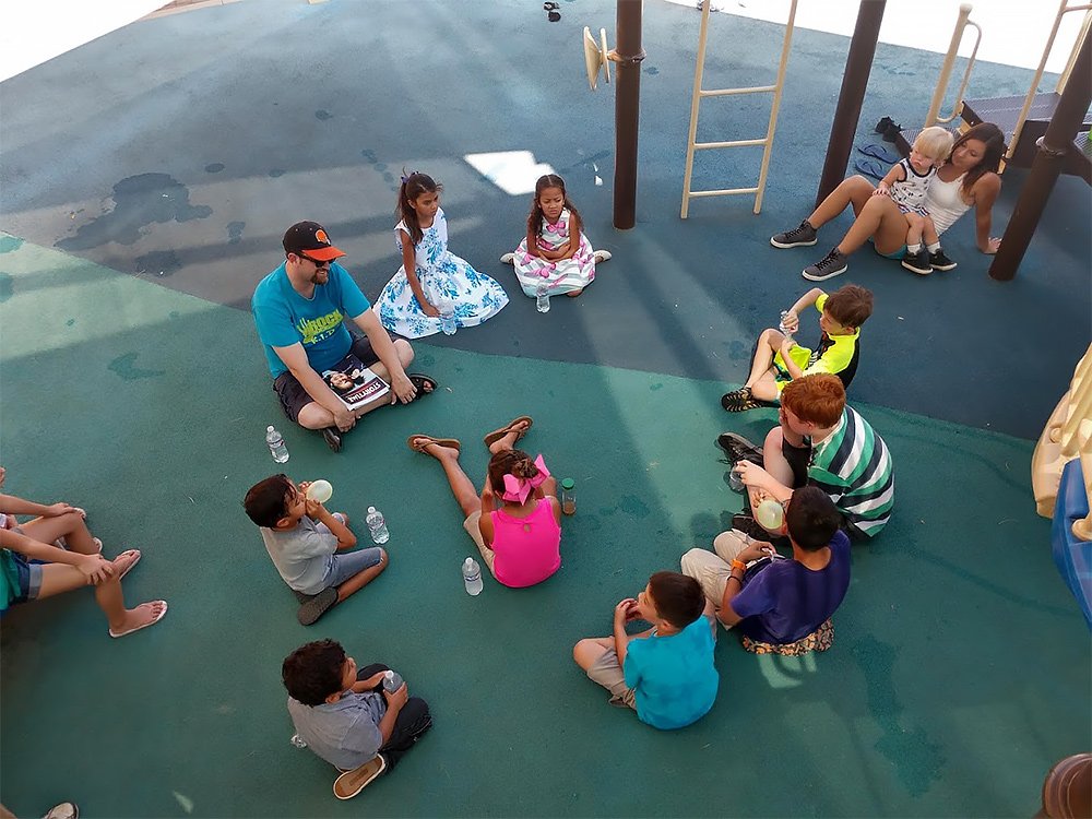  Children sitting outside after their children’s church ministry lesson at The Rock Church of Sahuarita 